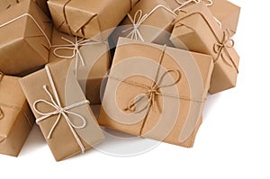 Pile or heap of brown paper packages isolated on white background