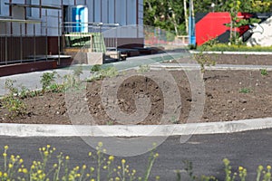 Pile heap dirt on ground near building