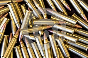 Pile of 17HMR Hornady Rimfire Cartridges photo