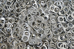 Pile of hoop can opener or pull ring as recycle, reuse again or
