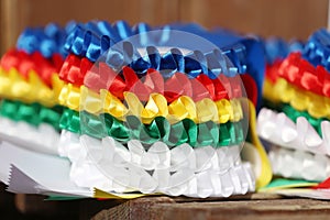 Pile of horse sport trophies rosettes at equestrian event