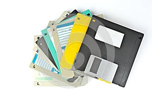 A pile of 3.5 Inch Floppy disks for background. Retro digital storage technology.