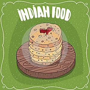 Pile of Indian round flatbread on wooden plate