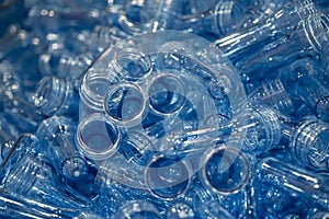The pile of injection preform shape of PET bottles.