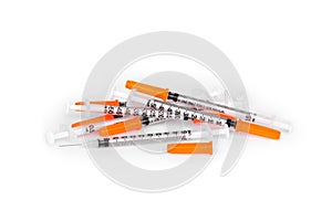 Pile of insulin syringe isolated on white background