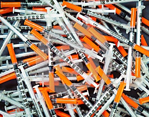 Pile of Insuline syringes for Diabetes Glucose Control photo