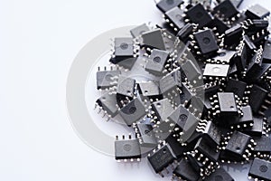 Pile of Integrated circuit chip on white background with copyspace. Microchip type soic8