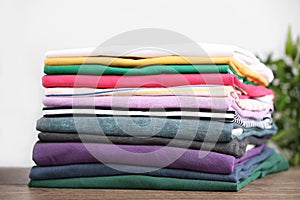 Pile of ironed clothes on table
