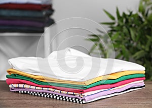 Pile of ironed clothes on table