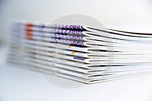 a pile of journals on a white background