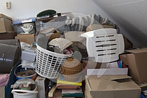 Pile of junk in a house, hoarder room pile of household equipment needs clearing out