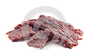 A Pile of Kippered Beef Steak Beef Jerky Isolated on a White Background