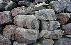 Pile of large stones stacked to make fence