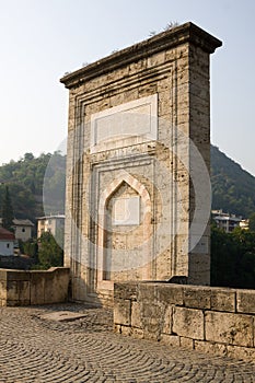 The pile with laudatory inscriptions on the Mehmed Pasha Sokolovic bridge in Visegrad, Bosnia and Herzegovina