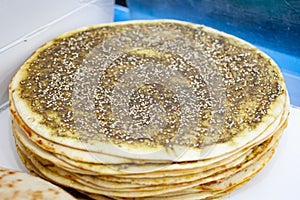 Pile of lebanese beef meat and sesame pancakes photo