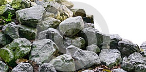 Pile of lime stone rocks in close up isolated on a white background nice garden decoration