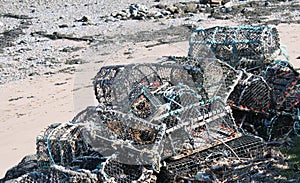 Pile of lobster of creel pots on beach