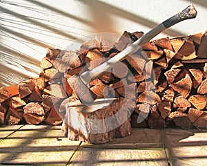 A Pile of Logs and an Axe