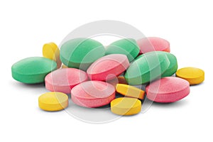 Pile of medical pills in round shape and different colors on white isolated background with shadow
