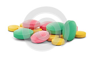 Pile of medical pills in round shape and different colors on white isolated background with shadow