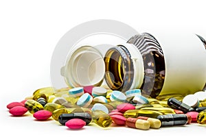 Pile of medicine pills and drug capsules with pill bottles