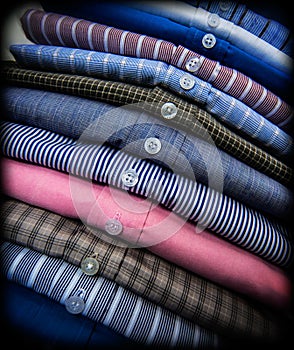 pile of men's dress shirts