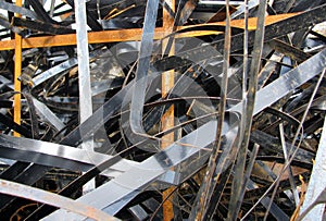 Pile of metal scrap strips background