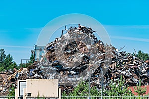 A pile of metal waste in the open air collected for recycling. Scrap metal on recycling site