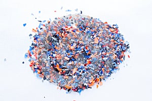 A pile of microplastics - small pieces of hard plastic, intended for further processing.