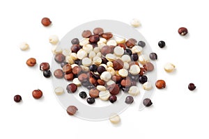 Pile of mixed quinoa closeup isolated on white background