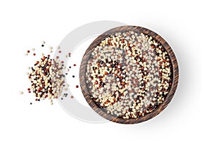 Pile of mixed raw quinoa, grain in wood bowl isolated on white background