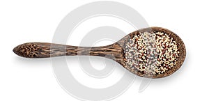 Pile of mixed raw quinoa, grain in wood spoon isolated on white background