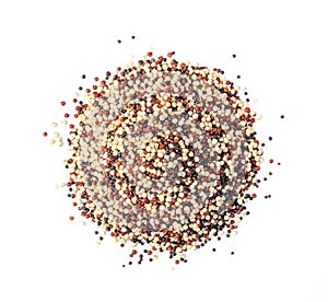 Pile of mixed raw quinoa isolated on white background.