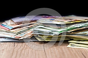 Pile money: dollars and euros banknotes on desk