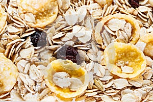 Pile Muesli Breakfast with oat flakes raisins. Close up view. The concept of Healthy eating. Abstract cereal grain pattern