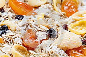 Pile Muesli Breakfast with oat flakes raisins. Close up view. The concept of Healthy eating. Abstract cereal grain pattern