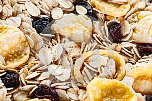 Pile Muesli Breakfast with oat flakes raisins. Close up view. The concept of Healthy eating. Abstract cereal grain pattern