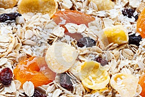 Pile Muesli Breakfast with oat flakes raisins. Close up view. The concept of Healthy eating. Abstract cereal grain pattern