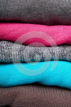 pile of multi color fabric texture, wool cloth isolated on white background