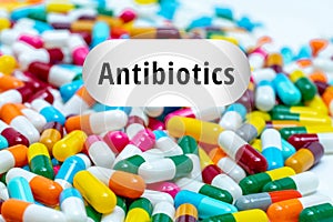 Pile of multi-colored antibiotics capsule pills. Antibiotic drug resistance concept. Prescription drugs. Superbug concept. photo