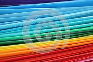 A pile of multicolored folders