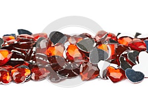 Pile of multiple heart shaped beads isolated