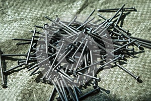 a pile of nails scattered on the building surface