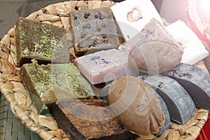 Pile of Natural handmade soap bars with flowers, spa organic soap