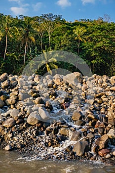 Pile of natural rocks by the river