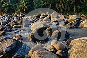 Pile of natural rocks by the river