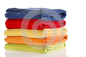 Pile of neatly folded colorful cotton towels