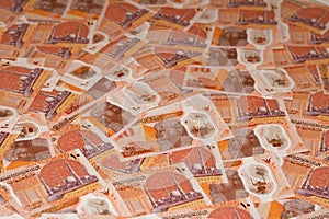 Pile of the new first Egyptian 10 LE EGP ten pounds plastic polymer banknote with Administrative capital's grand mosque