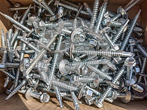 Pile of new screws - industrial