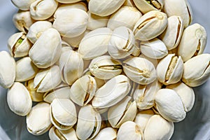 Pile nut of Pistachio or Pistacia vera in a bowl